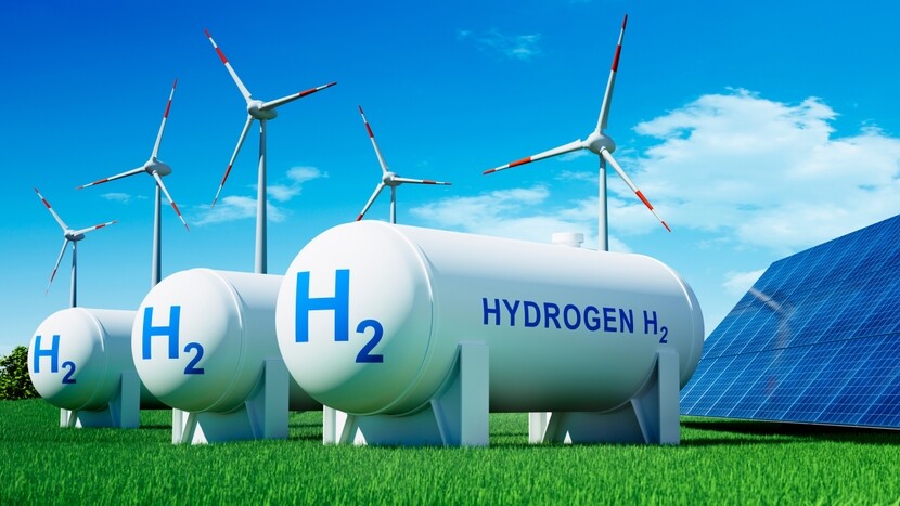H2 Tanks auf grüner Wiese vor Windrädern H2 Tanks auf grüner Wiese vor Windrädern